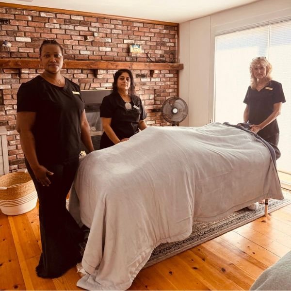 Therapists preparing a treatment room